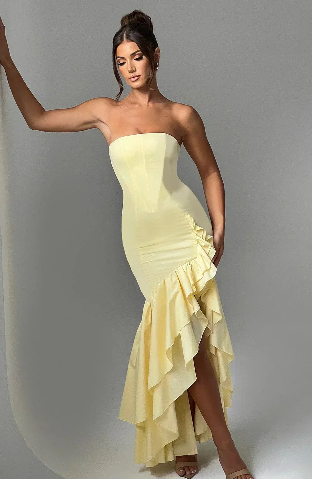 Graceful women's summer maxi dress: sleeveless, ruffled design with a fashionable slit.