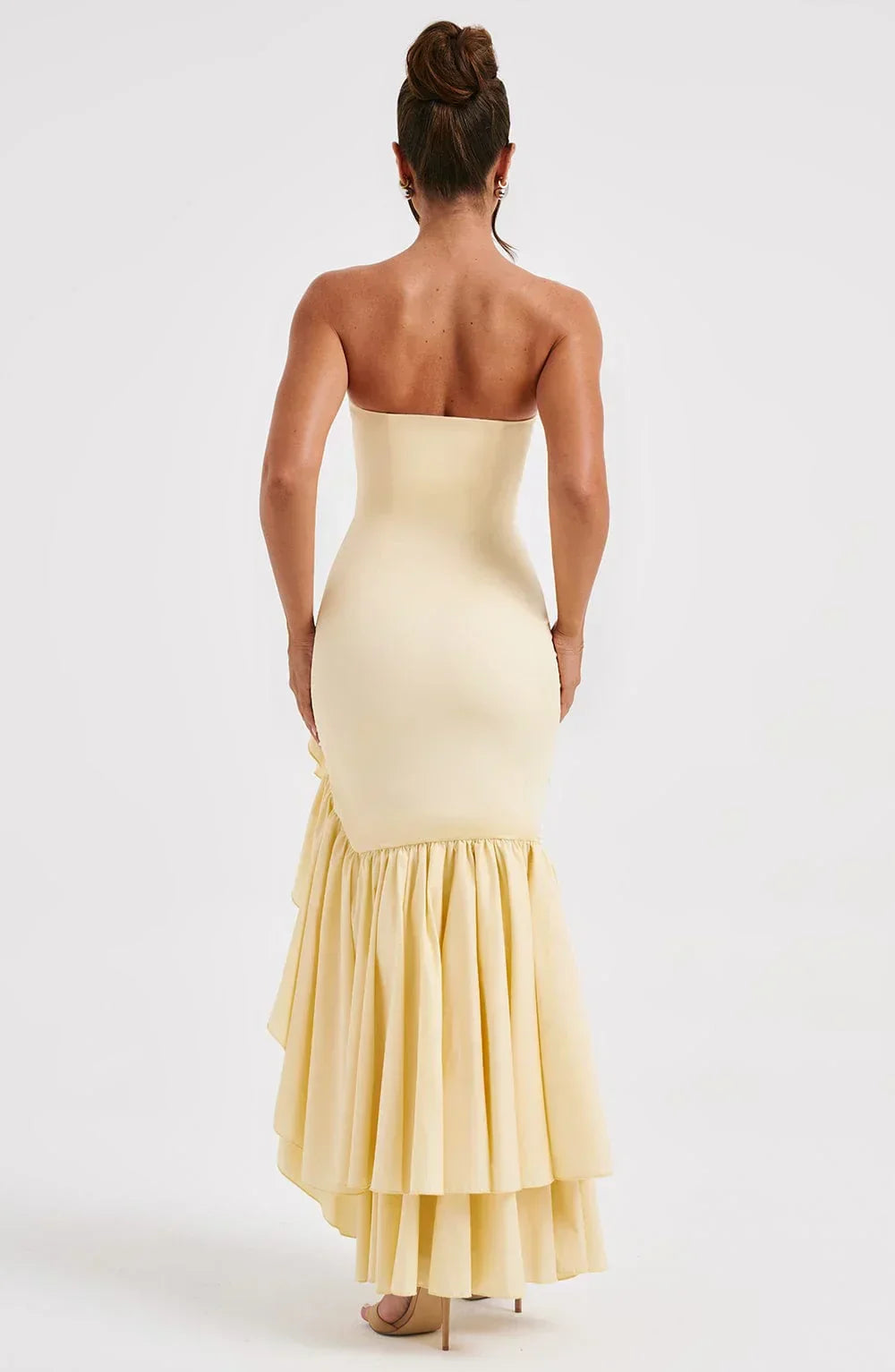 Women's sophisticated sleeveless ruffle maxi dress with a high slit, perfect for evening wear.