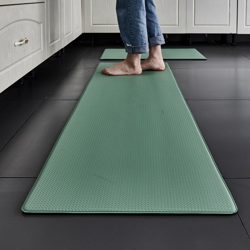 "Anti-slip waterproof kitchen rug with comfort cushioning, durable PVC, two-sided no-slip design, in grey rhombus pattern."