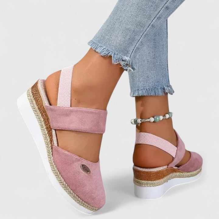 Ergonomic women's comfort sandals with contoured arch support, providing cushioned walking experience.