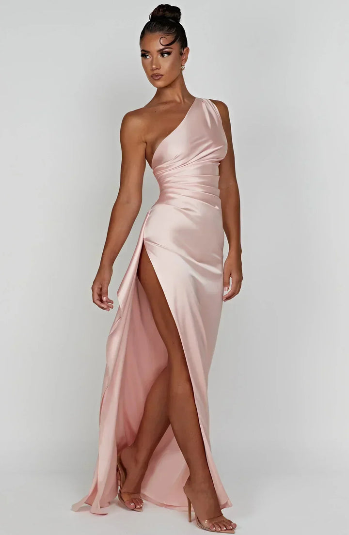 Sophisticated one-shoulder party dress, maxi length, and alluring high slit.