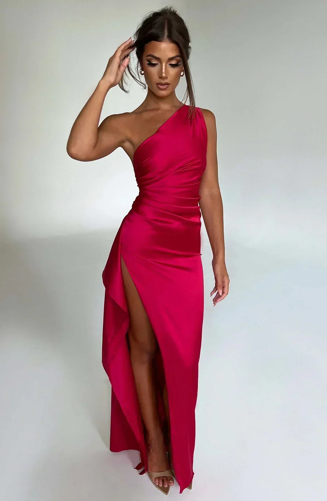 Elegant women's one-shoulder maxi dress with high slit, perfect for formal events.
