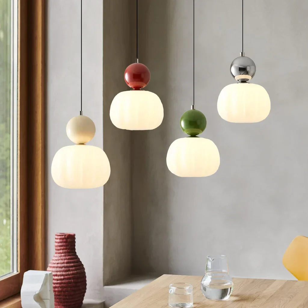 "Art Deco Cream Pendant Light with Bauhaus design, features high-quality metal frame and warm glow for elegant home lighting.