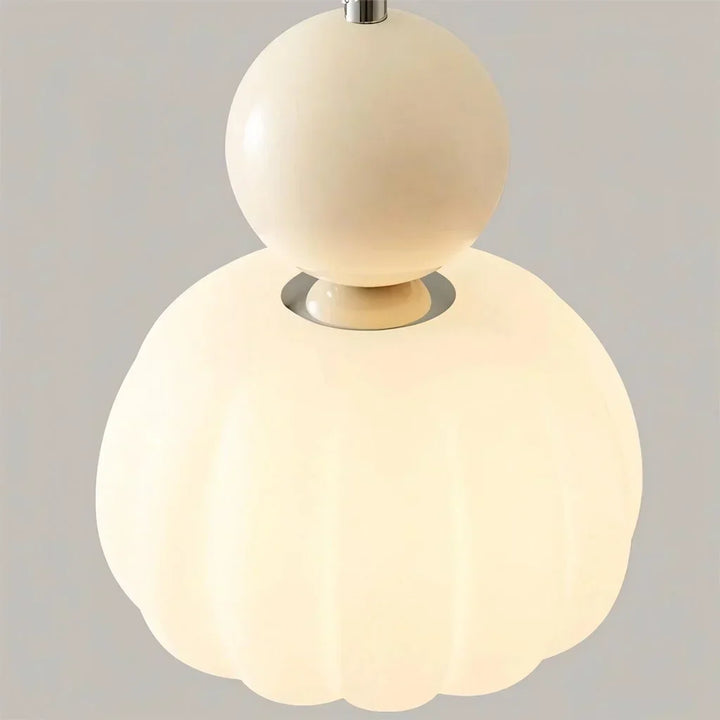 "Art Deco Cream Pendant Light with Bauhaus design, features high-quality metal frame and warm glow for elegant home lighting.
