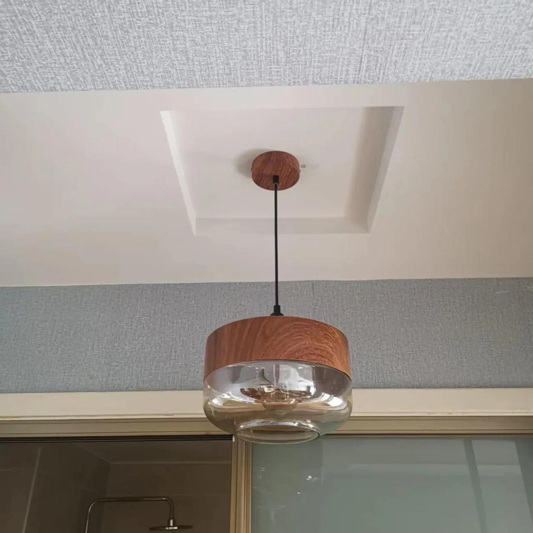 Arven wooden pendant light, timeless Scandinavian design, elegant glass shade, warm lighting.