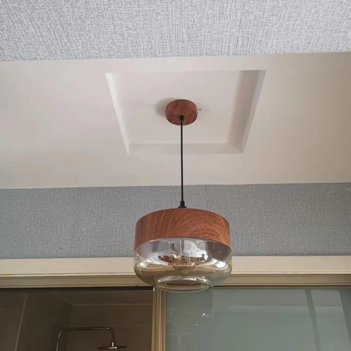 Arven wooden pendant light, timeless Scandinavian design, elegant glass shade, warm lighting.