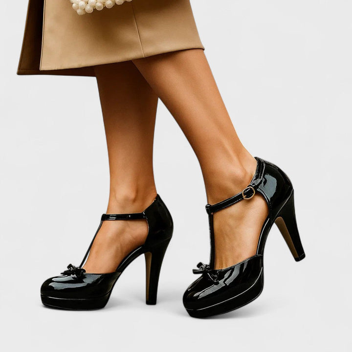 Stylish women's orthopedic black heels with a comfortable block heel, ideal for professional or elegant wear.