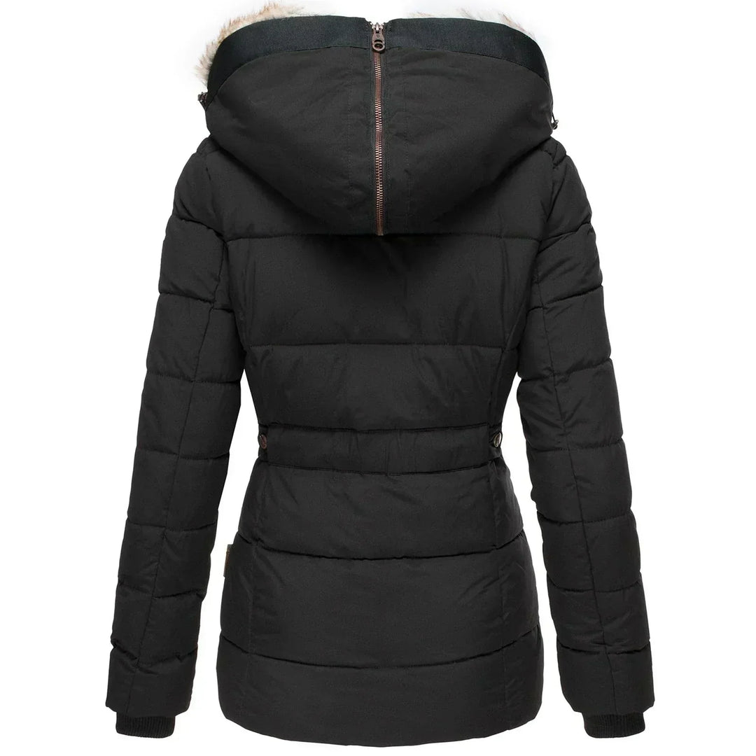 Cozy women's fashion puffer coat, designed for supreme warmth with a luxurious faux fur hood.