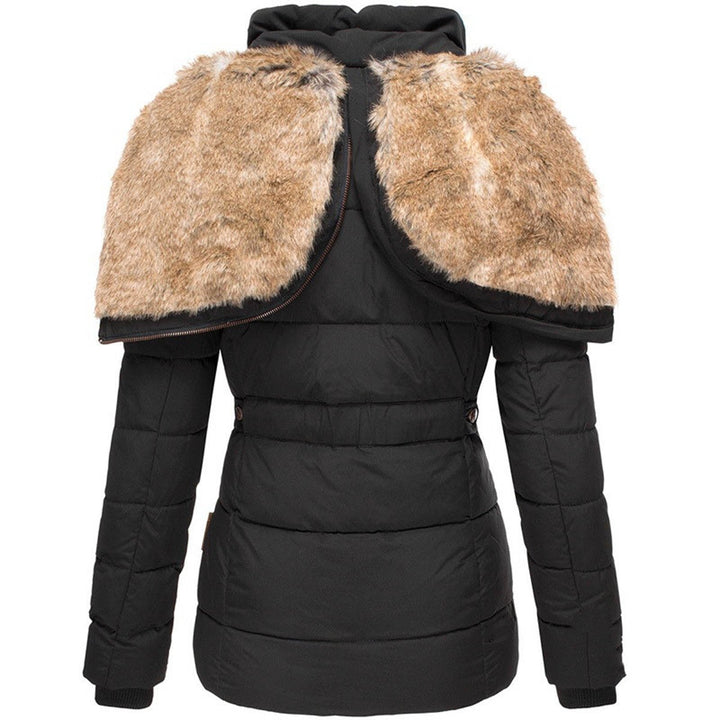 Elegant women's quilted puffer jacket featuring a stylish faux fur hood, ensuring ultimate winter warmth.