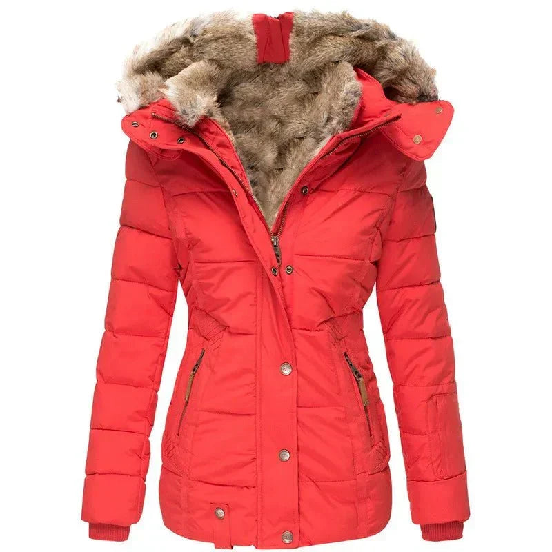 Detail of high-quality zipper on a women's warm winter puffer jacket with a stylish faux fur hood.