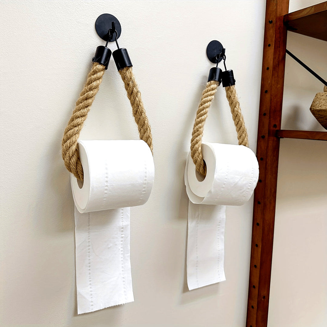 Hemp rope toilet paper holder for rustic bathroom decor. Wall mounted, natural jute style.