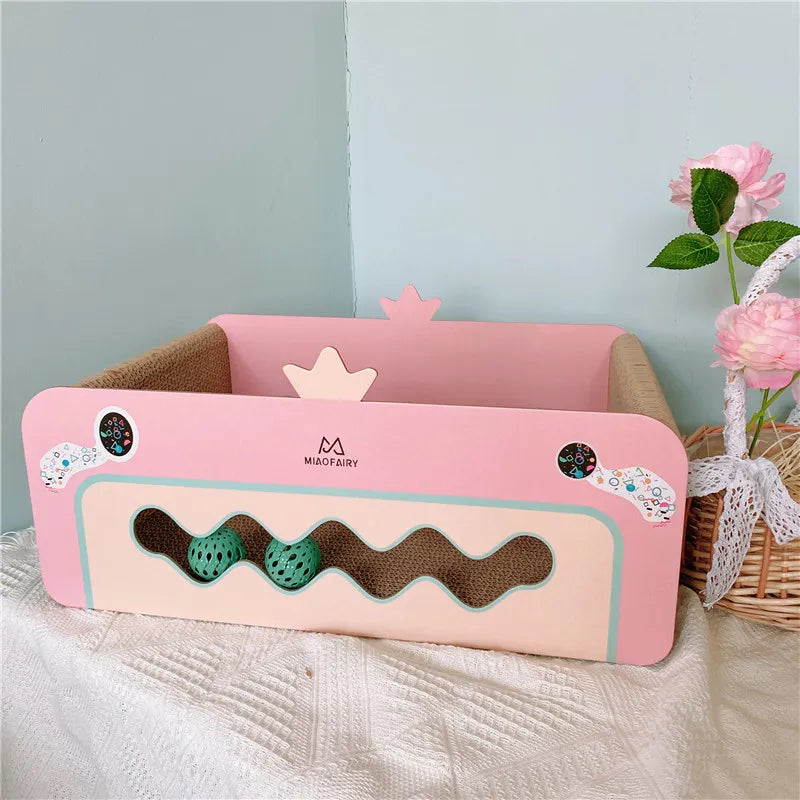 Durable pink cat scratch box, an essential pet scratcher accessory with a play toy for hours of kitten entertainment.