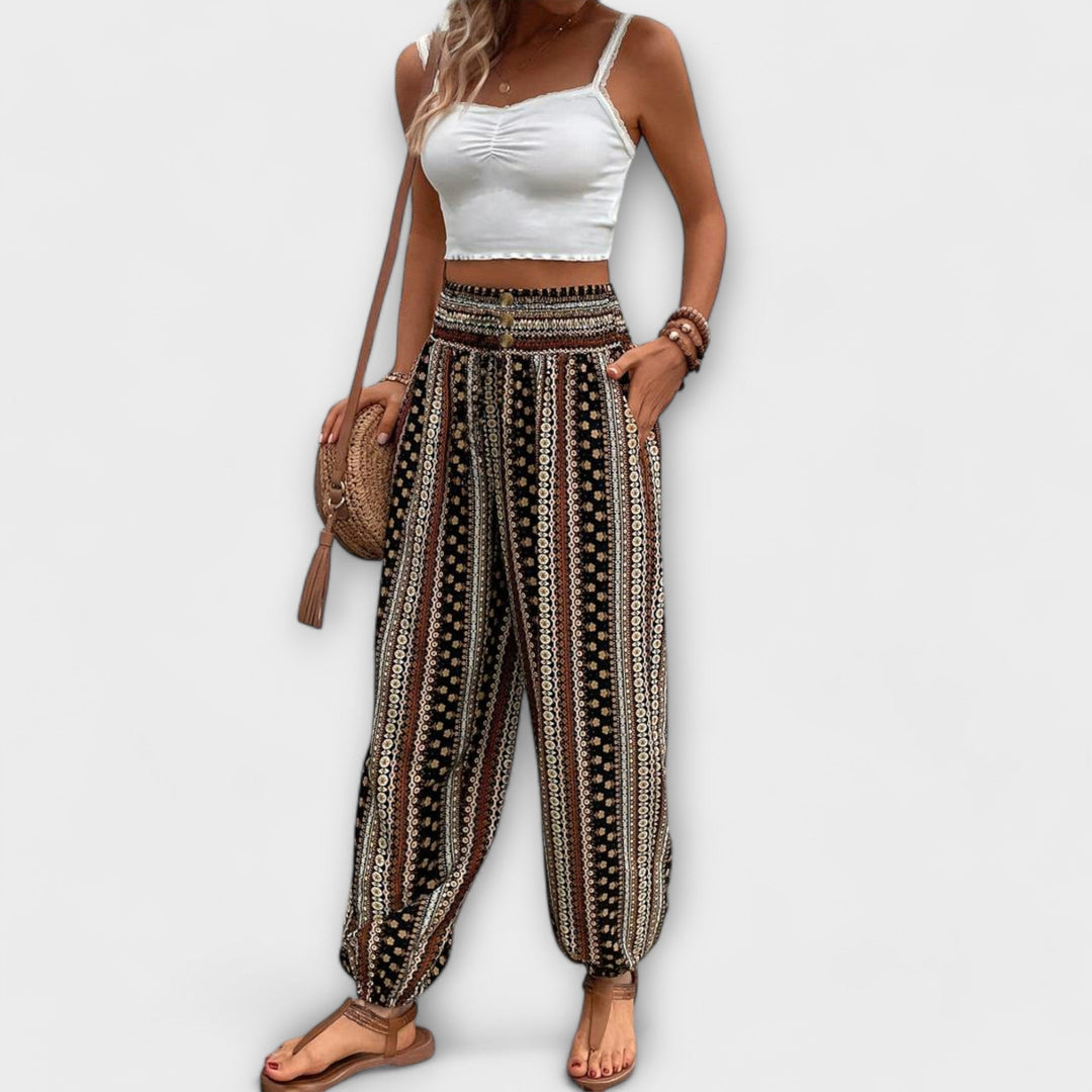 Elegant patterned women's trousers with a unique graphic design for fashion.