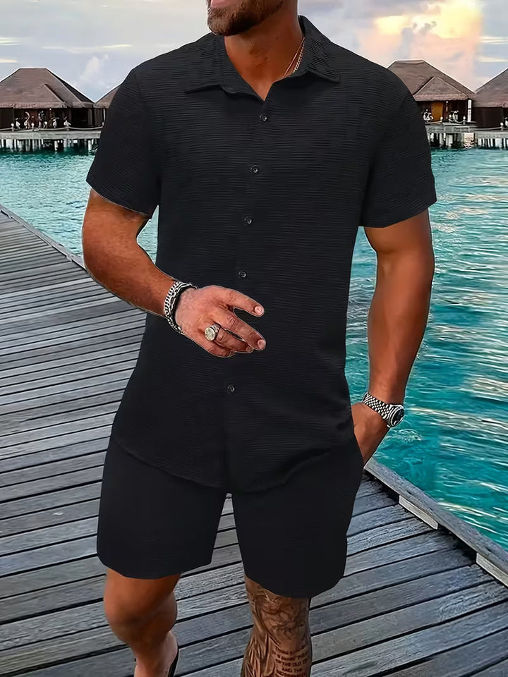 Stylish men's two-piece summer set: casual button shirt and matching shorts. Perfect holiday or beachwear.
