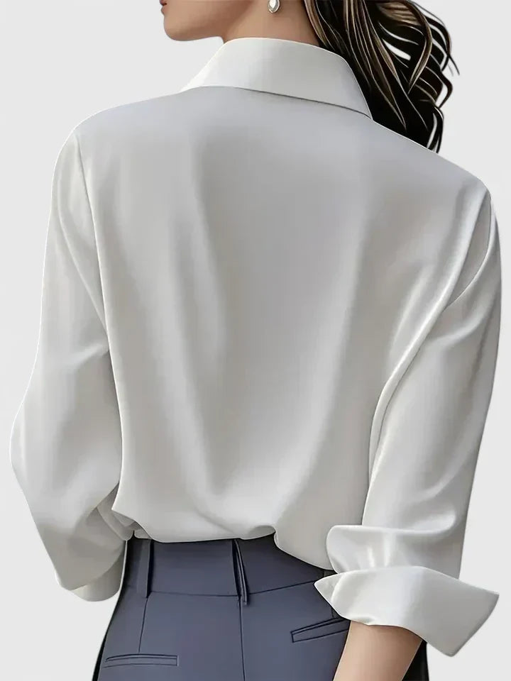 Essential women's elegant button-down blouse. Classic long sleeve top, versatile for office & casual chic style.