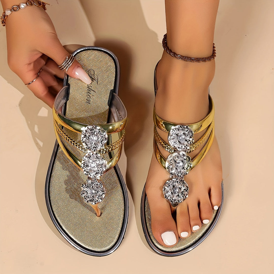 Comfortable women's T-strap flat sandals with sparkly rhinestones, perfect for everyday wear.