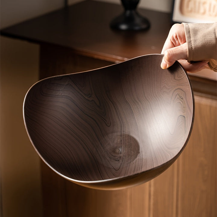 Modern large fruit bowl, polypropylene with elegant wood look finish, ideal for table decor.