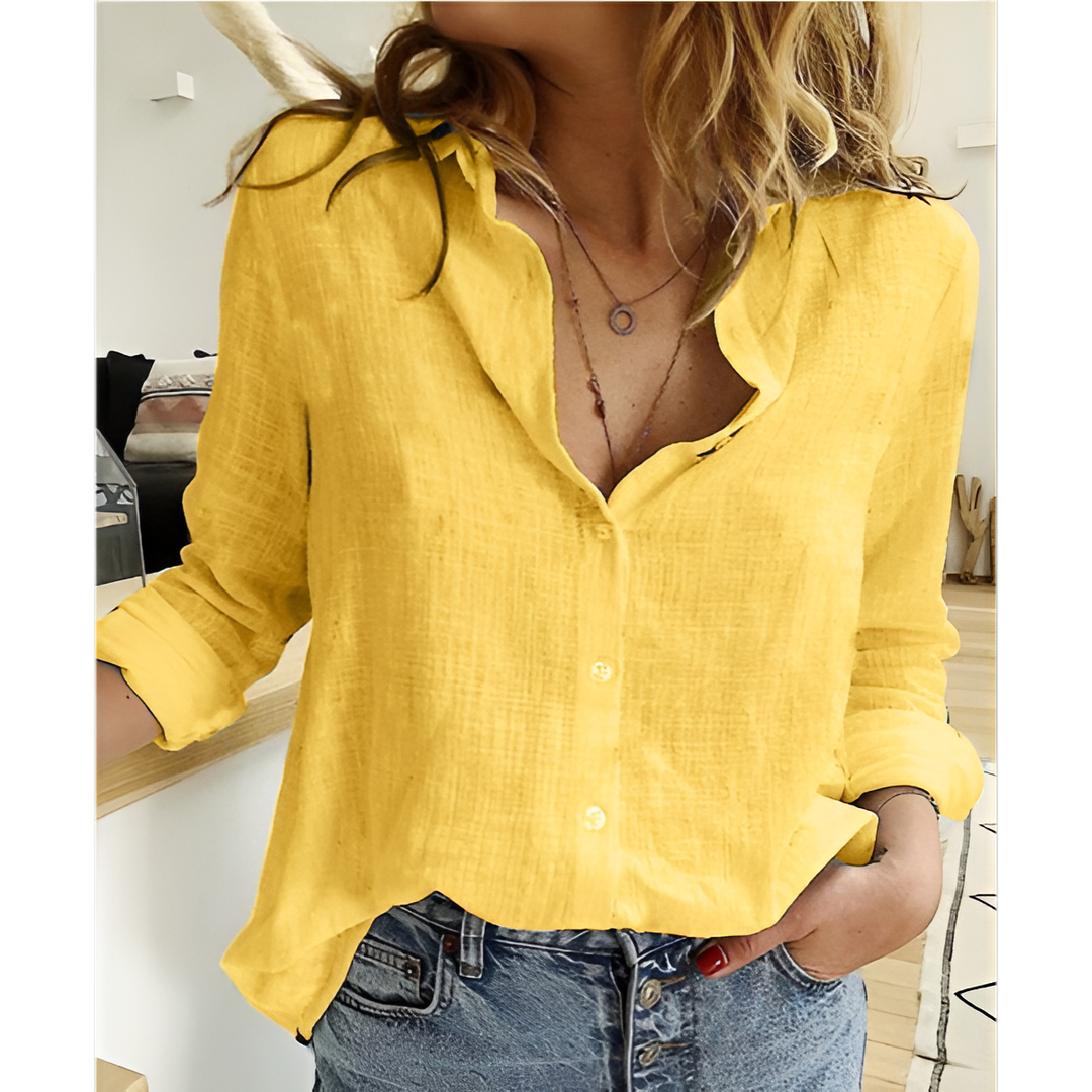 Classic women's button-up shirt, elegant long sleeve top offering everyday style and comfort.