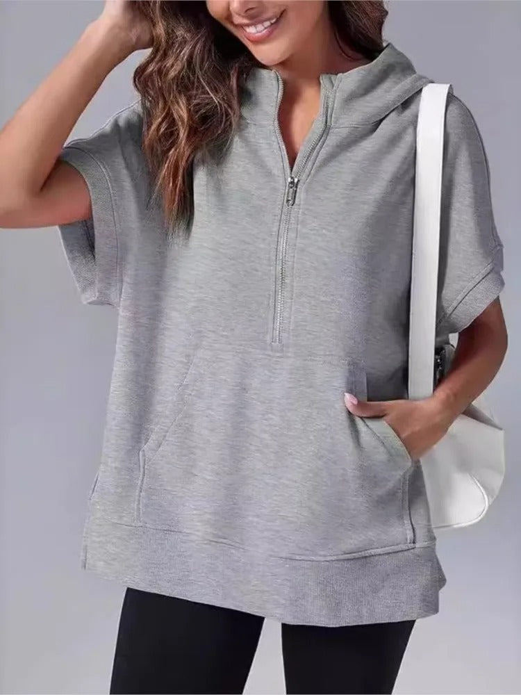 Comfortable women's short sleeve hoodie, half-zip design, relaxed fit for casual fashion.