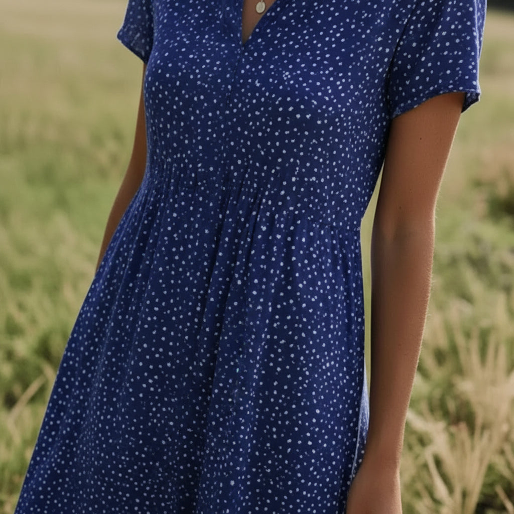 Flowy women's Tansy midi dress, designed for ultimate comfort & effortless style. Great for summer days.