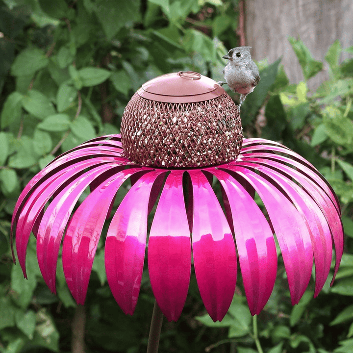 Beautiful metal flower garden ornament and bird feeder, perfect for nature lovers.