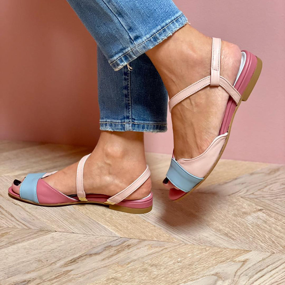 Stylish women's asymmetrical pink sandals offering elegant comfort, versatile for both casual and festive occasions.