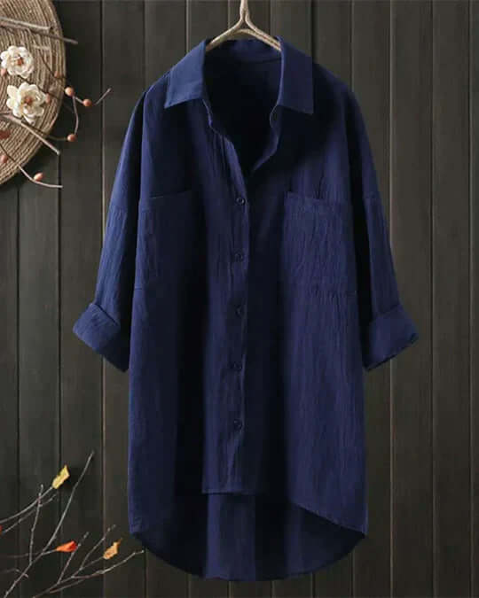 Chic women's white flowy blouse with long sleeves. Elegant loose fit, button-down, perfect versatile everyday summer top.
