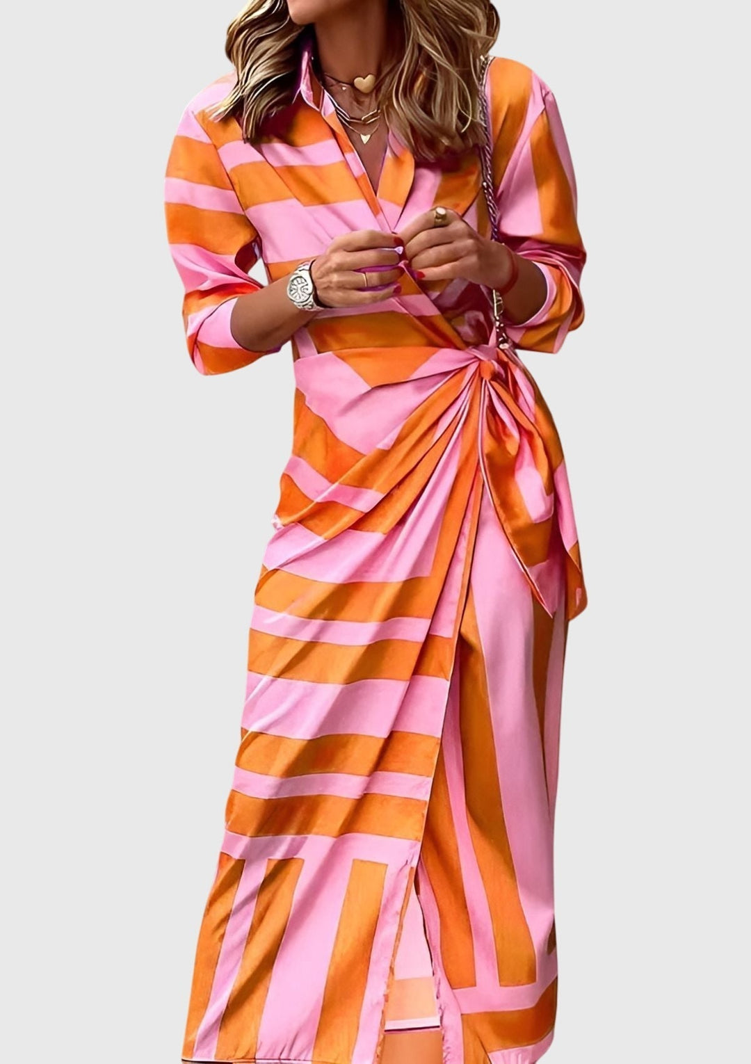 Close-up of elegant women's printed midi wrap dress fabric, showcasing unique pattern & V-neck.