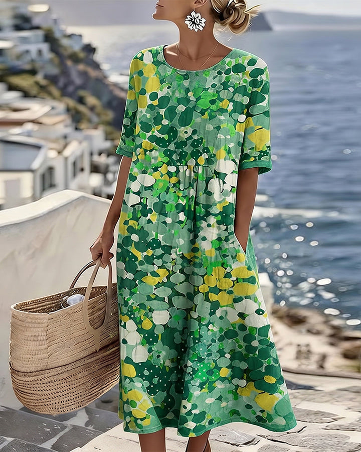 Comfortable women's floral midi dress with short sleeves & round neck, ideal for spring casual style.