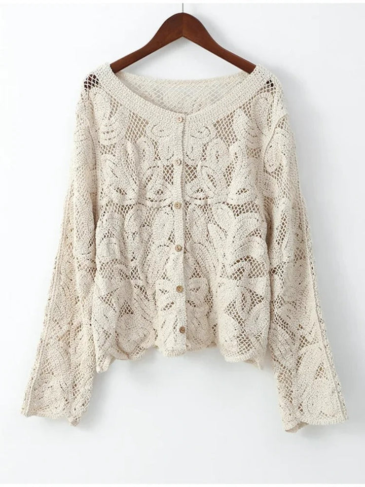 Airy crocheted apricot cardigan for women, elegant and lightweight summer layering top. Handcrafted chic style.