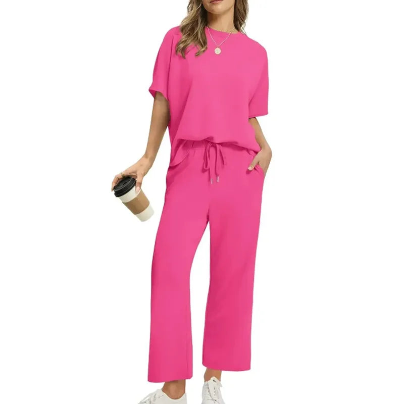 Women's chic ribbed top and trouser set for casual wear. Relaxed fit, round neck, half sleeve, comfy loungewear.