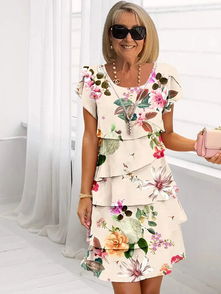 Comfortable short sleeve women's floral mini dress, tiered design, perfect for casual spring and summer wear. Effortless style.