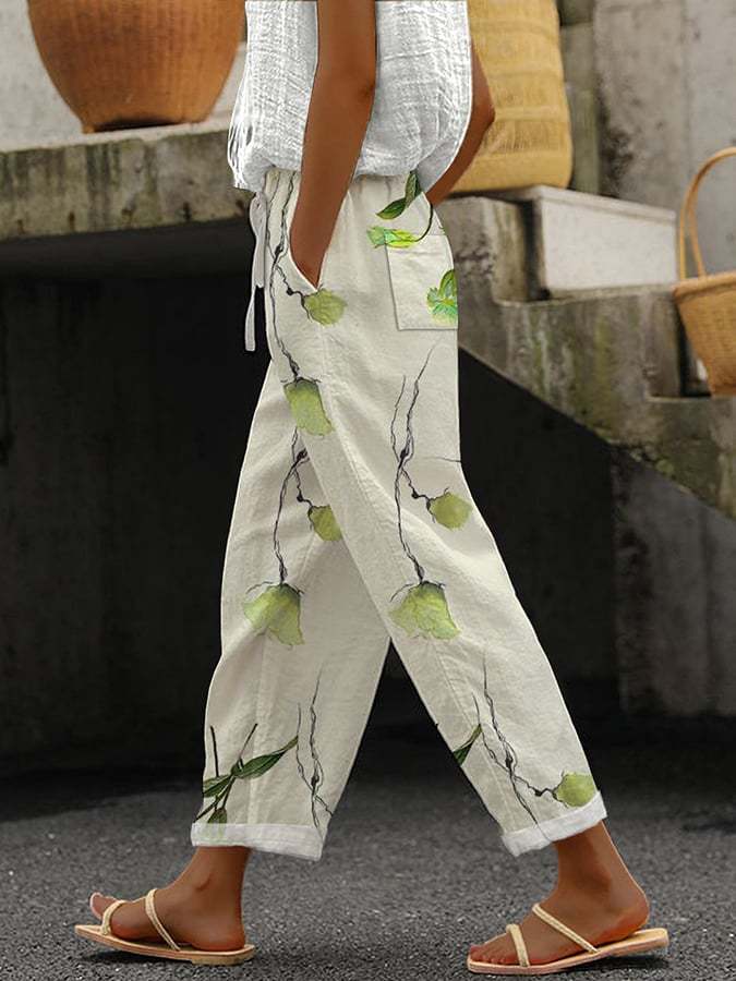 Loose fit wide leg printed pants for women, offering comfort and style. Versatile for casual or elegant summer outfits.