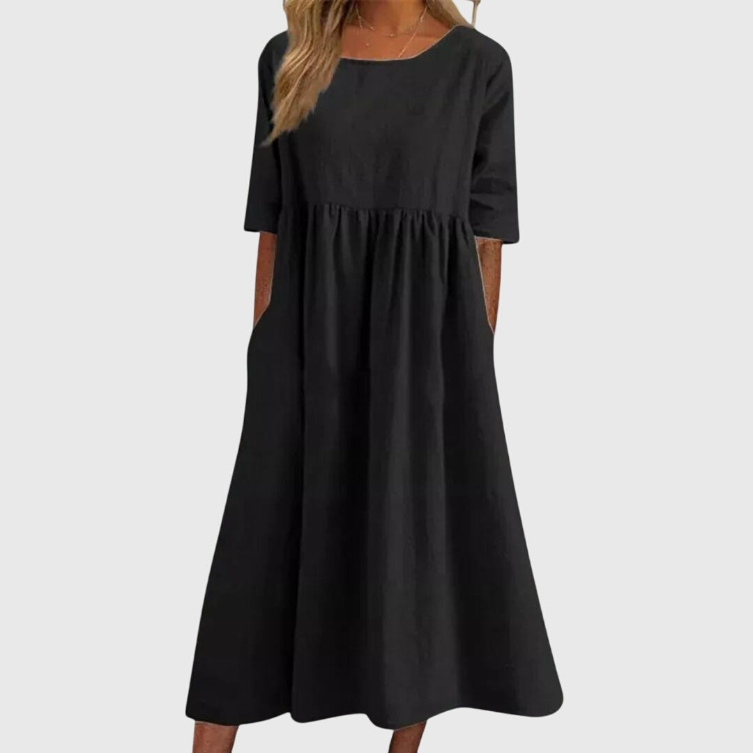 Timeless women's short sleeve midi dress, offering an elegant and flattering look for any season.