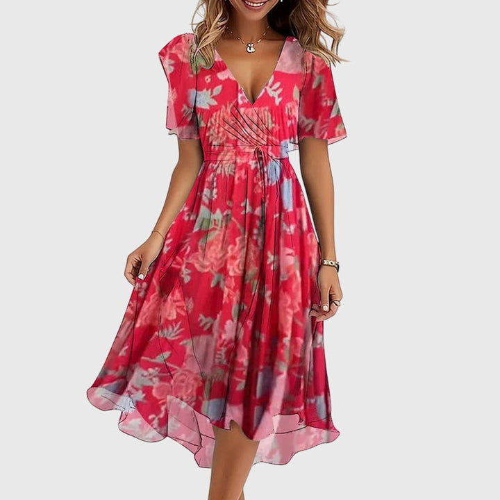 Chic women's flowy midi dress with elegant flutter sleeves, ideal for comfortable spring and summer wear.