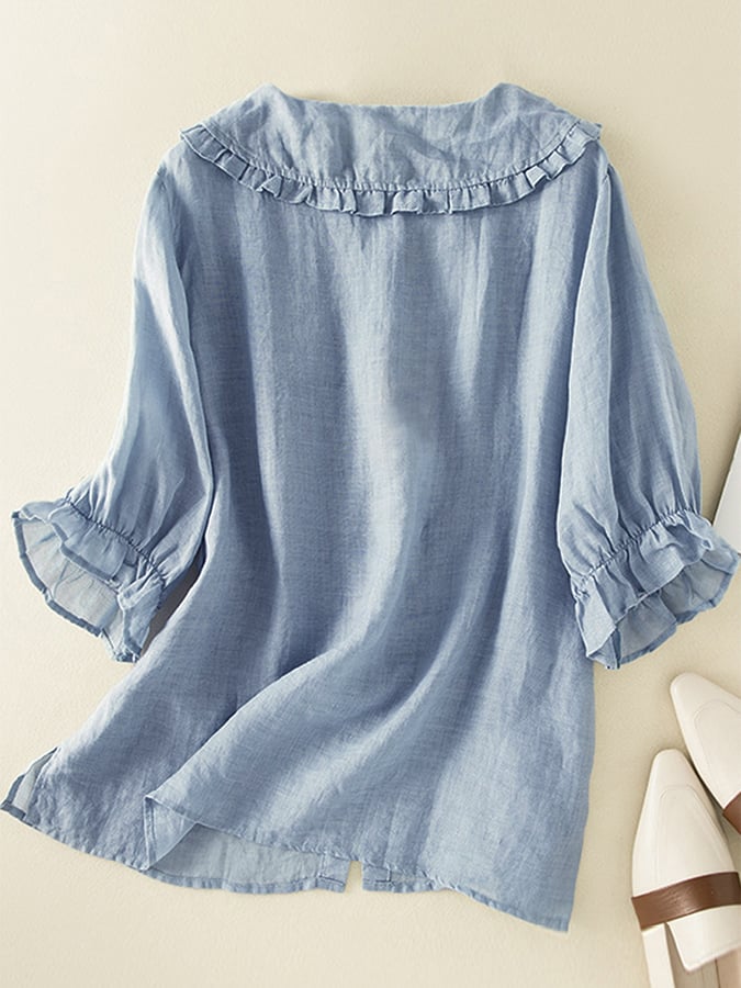 Fashionable women's top featuring a loose fit and ruffled neckline, a versatile blouse for various stylish outfits.