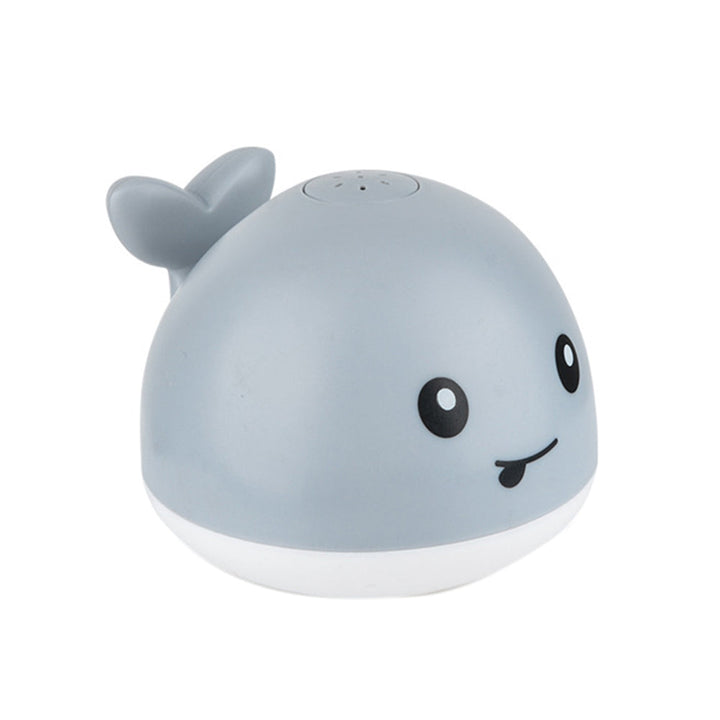 Baby's light-up whale sprinkler bath toy with colorful LED lights for fun water play & sensory exploration.