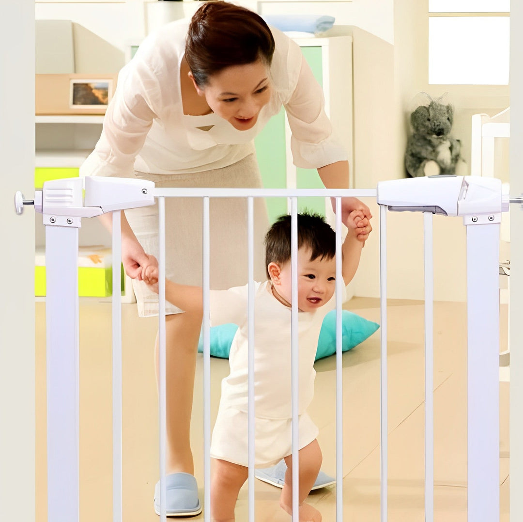 Baby Safety Stair Gate, white, installed at top of stairs, secure child protection barrier.