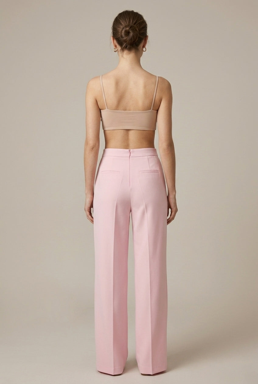 Full view of women's pink feather cuff blazer and matching straight leg trousers set. Elegant fashion, tailored fit.