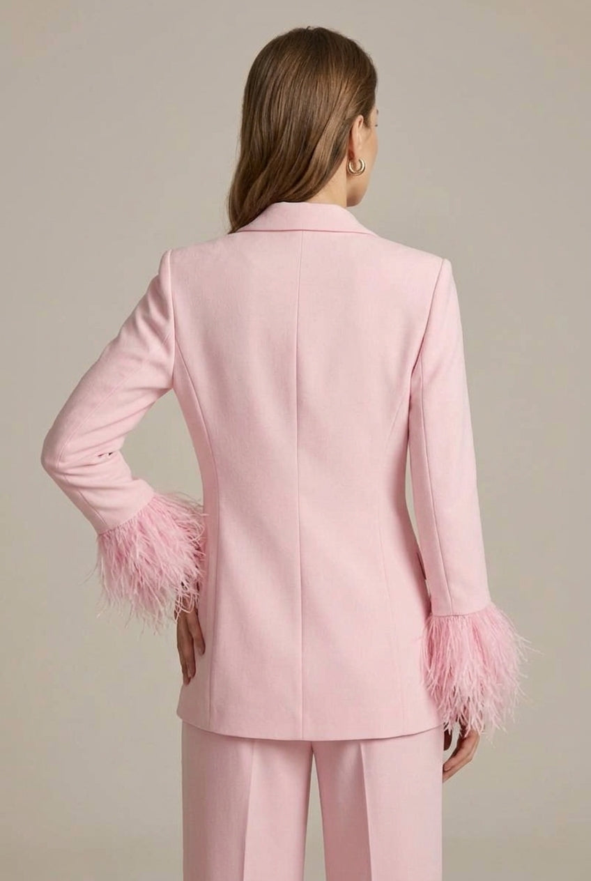 Women's tailored pink trouser suit with feather cuff blazer, straight leg pants. Sophisticated office & occasion wear.