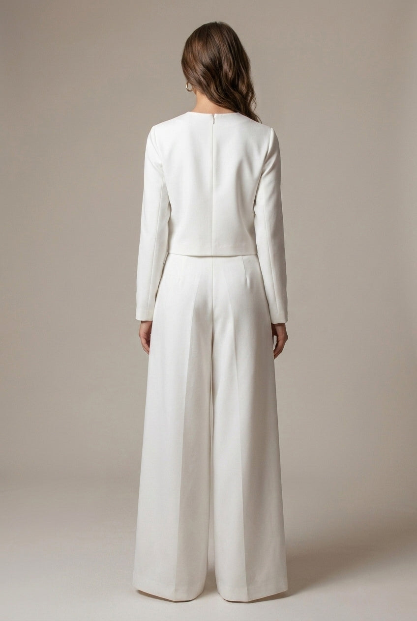 Stylish woman in a two-piece wide-leg palazzo outfit, versatile for casual outings or elegant workwear.