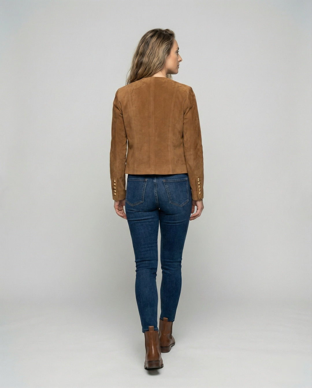 Chic ladies' fashion jacket featuring stylish gold buttons, ideal for an elegant and sophisticated look.