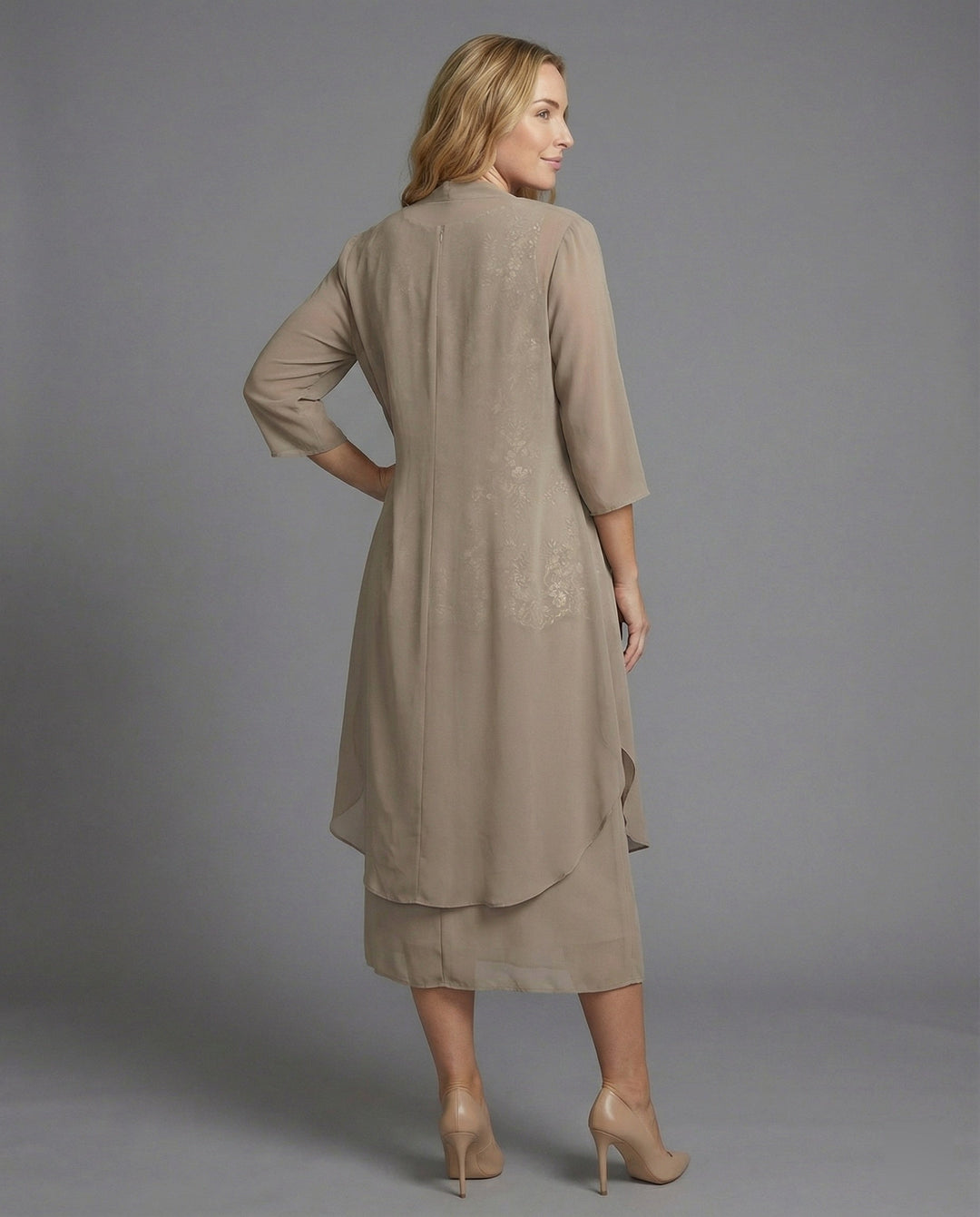 Stylish women's elegant two-piece outfit, great for vacation or summer fashion. Features 3/4 sleeves for a chic look.