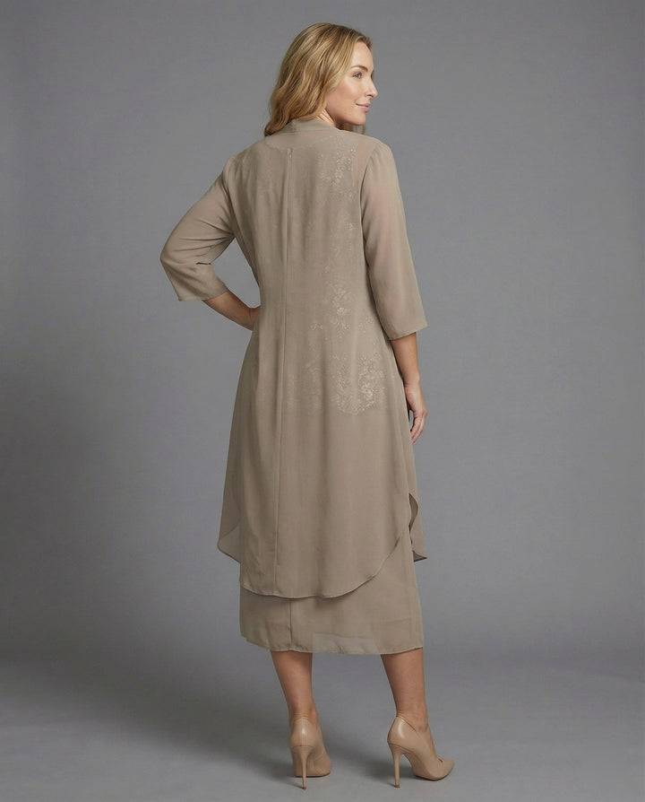 Stylish women's elegant two-piece outfit, great for vacation or summer fashion. Features 3/4 sleeves for a chic look.