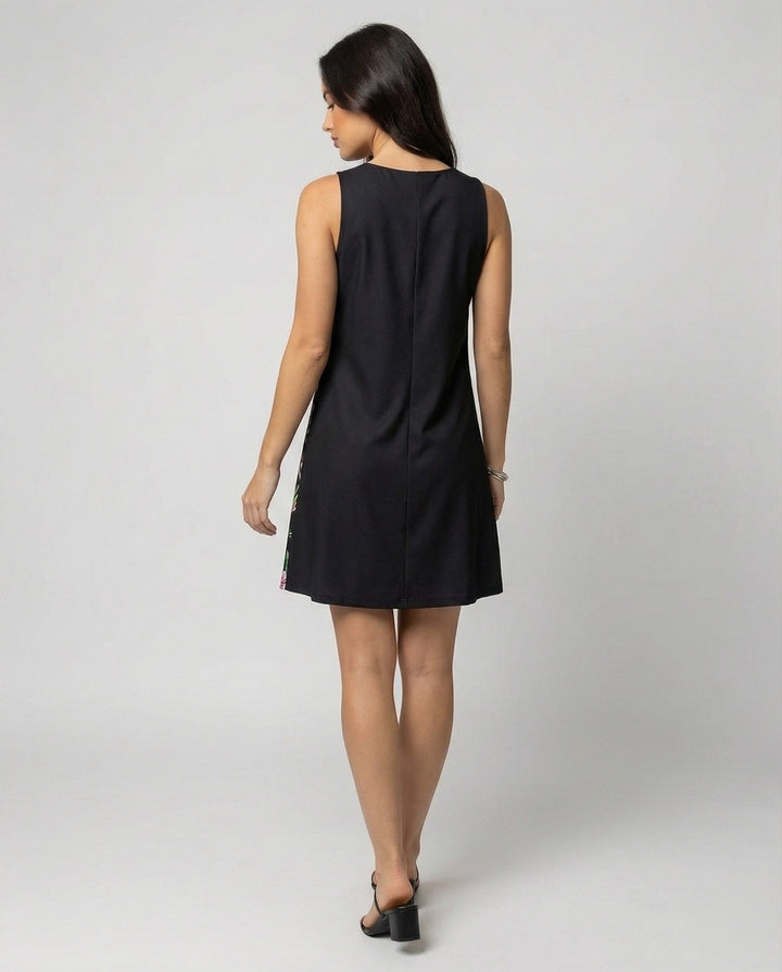Relaxed fit sleeveless casual dress featuring a vibrant artistic print for versatile styling.