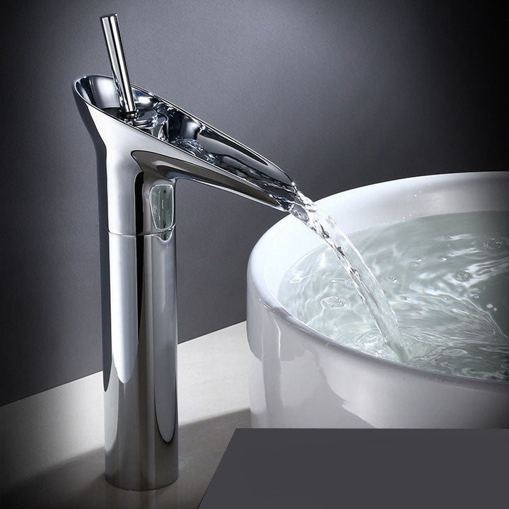 Single handle brass waterfall faucet, precise control for bathroom basins.
