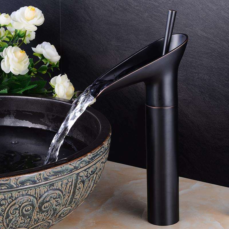 Contemporary brass waterfall basin mixer, single lever tap for bathroom vanity.