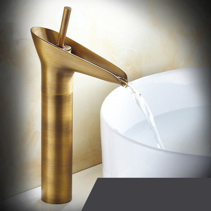 High-arc brass waterfall basin tap, elegant design, perfect for vessel sinks.