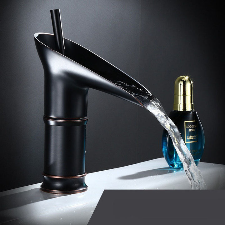 Stylish brass waterfall tap, easy installation in contemporary bathrooms.