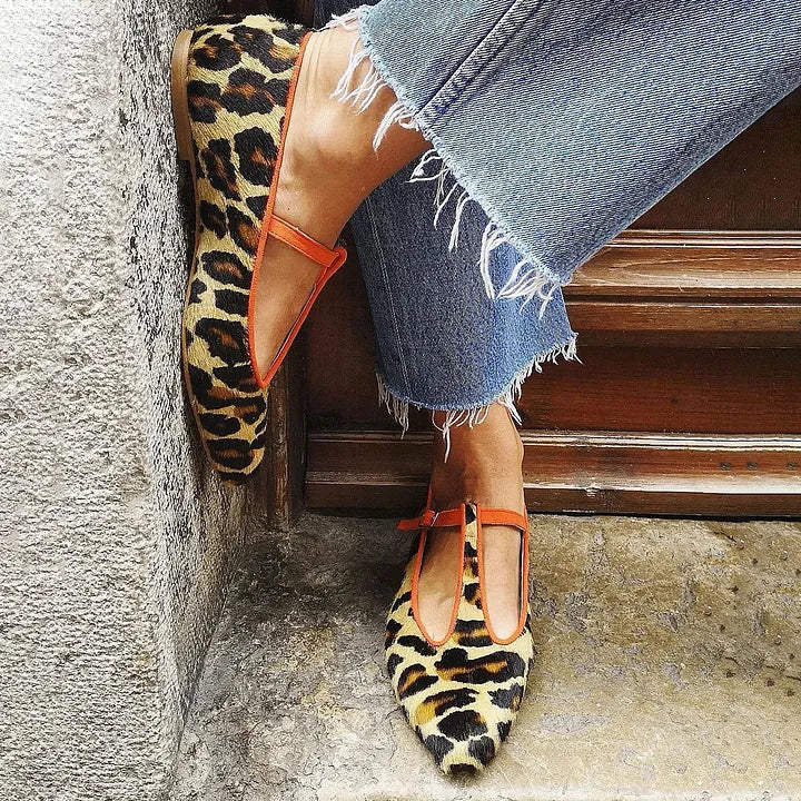 Women's elegant leopard print T-Strap flats. Stylish and comfortable footwear for daily wear.